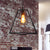 Trapezoid Living Room Pendant Lighting Vintage Metal 1 Light Black Ceiling Fixture with Cage Black Clearhalo 'Art Deco Pendants' 'Black' 'Cast Iron' 'Ceiling Lights' 'Ceramic' 'Crystal' 'Industrial Pendants' 'Industrial' 'Metal' 'Middle Century Pendants' 'Pendant Lights' 'Pendants' 'Rustic Pendants' 'Tiffany' Lighting' 314520