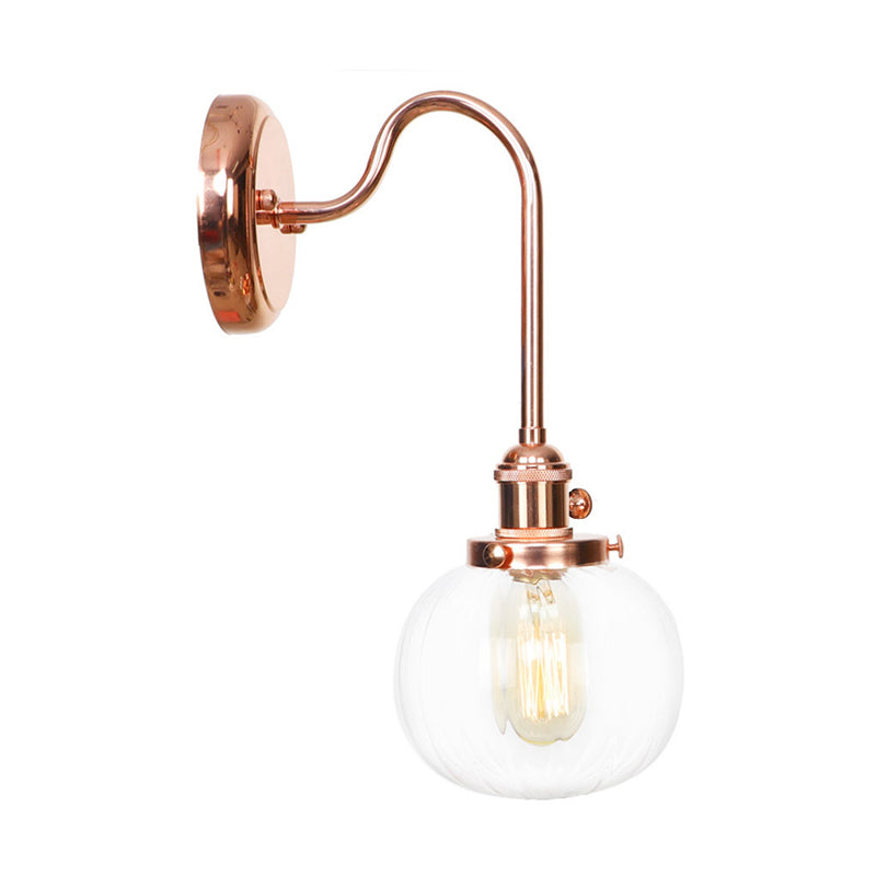 Vintage Globe Wall Lighting 1 Light Clear/Amber Glass Sconce in Copper with Curved Arm Clearhalo 'Art deco wall lights' 'Cast Iron' 'Glass' 'Industrial wall lights' 'Industrial' 'Middle century wall lights' 'Modern' 'Rustic wall lights' 'Tiffany' 'Traditional wall lights' 'Wall Lamps & Sconces' 'Wall Lights' Lighting' 315397