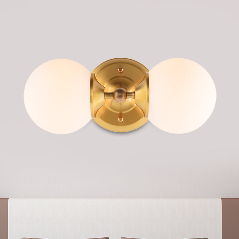Spherical Sconce Contemporary Milky Glass 2 Heads Wall Mount Light Fixture in Brass Clearhalo 'Cast Iron' 'Glass' 'Industrial' 'Modern wall lights' 'Modern' 'Tiffany' 'Traditional wall lights' 'Wall Lamps & Sconces' 'Wall Lights' Lighting' 324226
