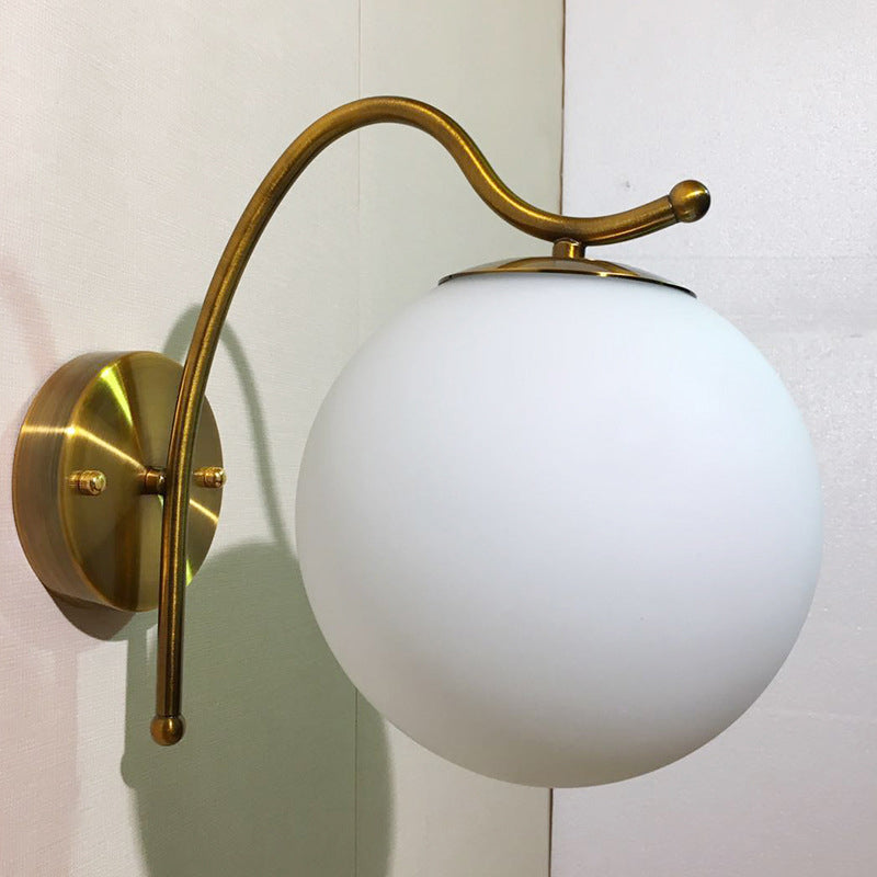 Ball Wall Lamp Modern White Glass 1 Head Gold Sconce Light Fixture with Metal Curved Arm - Clearhalo - 'Cast Iron' - 'Glass' - 'Industrial' - 'Modern wall lights' - 'Modern' - 'Tiffany' - 'Traditional wall lights' - 'Wall Lamps & Sconces' - 'Wall Lights' - Lighting' - 324241