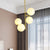 Modernist 4 Heads Pendant Chandelier Gold Ball Ceiling Hanging Light with Milky Glass Shade Gold Clearhalo 'Ceiling Lights' 'Chandeliers' 'Glass shade' 'Glass' 'Modern Chandeliers' 'Modern' Lighting' 324384