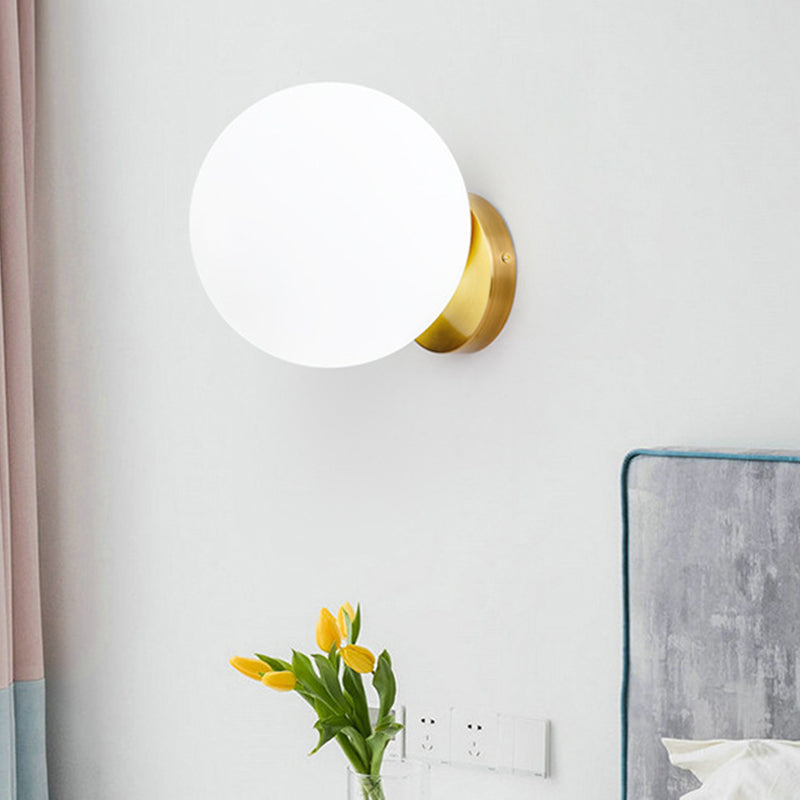 1 Bulb Bedroom Wall Lamp Modernist Gold Sconce Light Fixture with Ball Opal Glass Shade Gold Clearhalo 'Cast Iron' 'Glass' 'Industrial' 'Modern wall lights' 'Modern' 'Tiffany' 'Traditional wall lights' 'Wall Lamps & Sconces' 'Wall Lights' Lighting' 325014