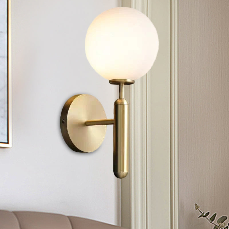 Milky Glass Ball Sconce Contemporary 1 Head Brass Wall Mount Light Fixture with Metal Pencil Arm Clearhalo 'Cast Iron' 'Glass' 'Industrial' 'Modern wall lights' 'Modern' 'Tiffany' 'Traditional wall lights' 'Wall Lamps & Sconces' 'Wall Lights' Lighting' 325130