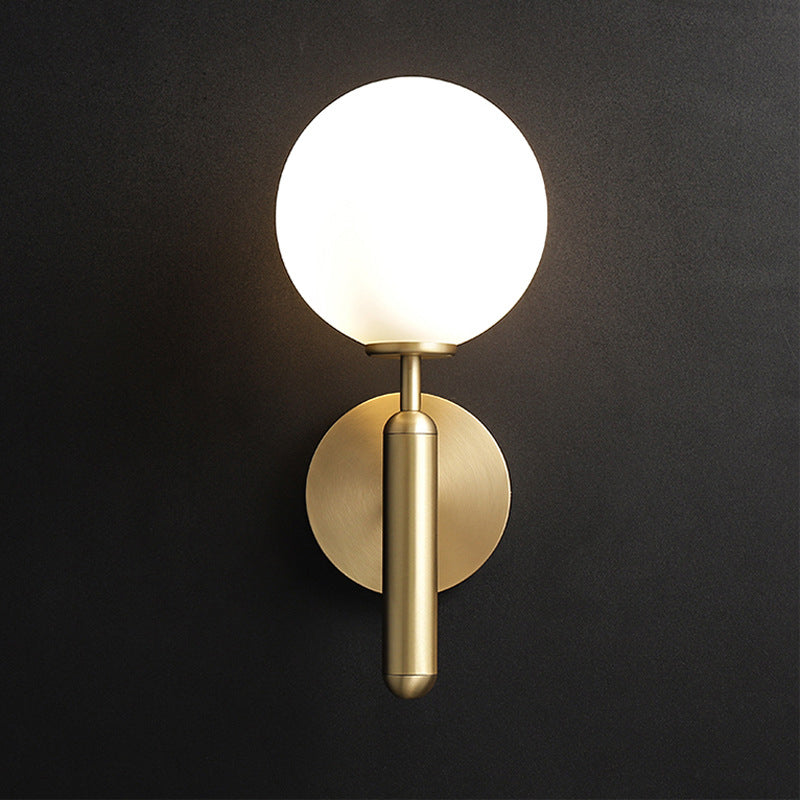 Milky Glass Ball Sconce Contemporary 1 Head Brass Wall Mount Light Fixture with Metal Pencil Arm Clearhalo 'Cast Iron' 'Glass' 'Industrial' 'Modern wall lights' 'Modern' 'Tiffany' 'Traditional wall lights' 'Wall Lamps & Sconces' 'Wall Lights' Lighting' 325131