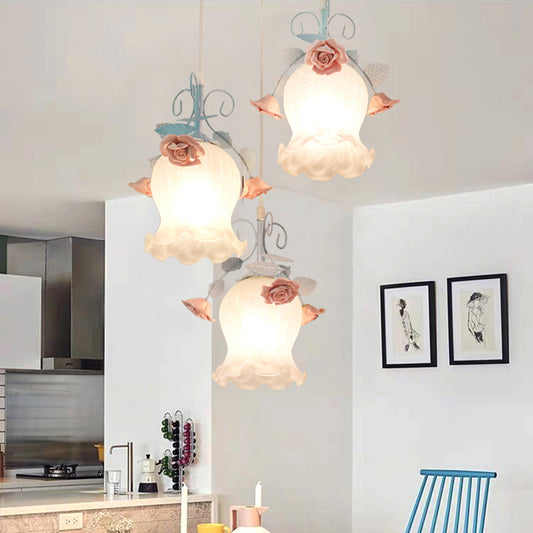 White Glass Rose Multi Light Pendant Pastoral 3 Bulbs Dining Room Suspension Lighting Fixture in Blue Blue Clearhalo 'Ceiling Lights' 'Glass shade' 'Glass' 'Pendant Lights' 'Pendants' Lighting' 325587