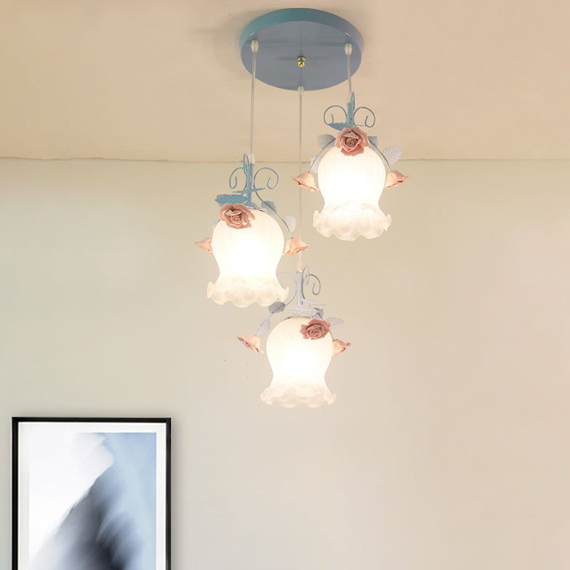 White Glass Rose Multi Light Pendant Pastoral 3 Bulbs Dining Room Suspension Lighting Fixture in Blue Clearhalo 'Ceiling Lights' 'Glass shade' 'Glass' 'Pendant Lights' 'Pendants' Lighting' 325589