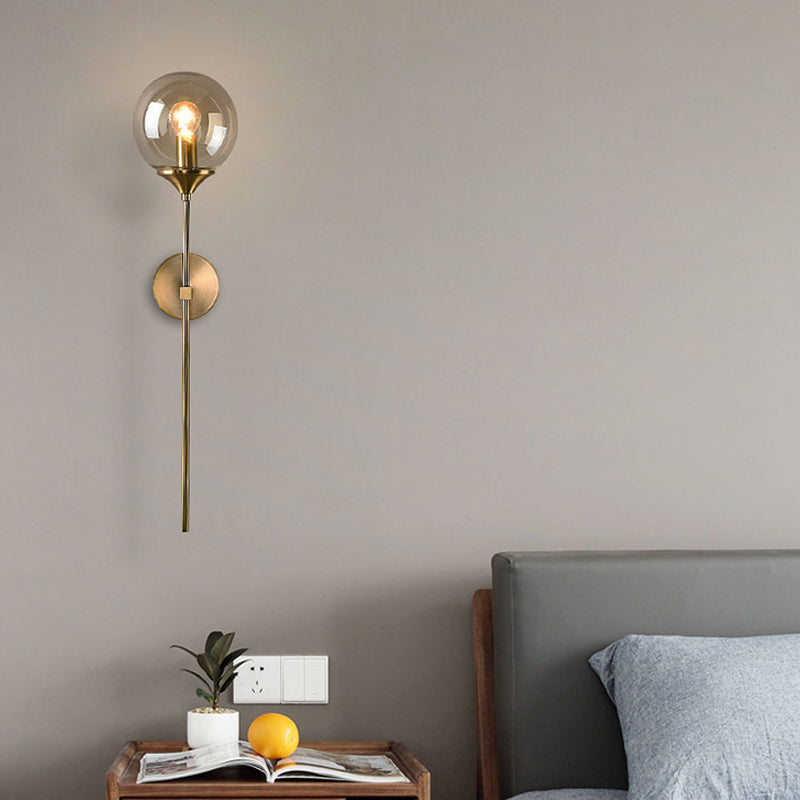 Modernist Round Wall Lamp Clear/Amber/Smoke Gray Glass 1 Bulb Bedside Sconce Light Fixture with Metal Pencil Arm - Clearhalo - 'Cast Iron' - 'Glass' - 'Industrial' - 'Modern wall lights' - 'Modern' - 'Tiffany' - 'Traditional wall lights' - 'Wall Lamps & Sconces' - 'Wall Lights' - Lighting' - 325675