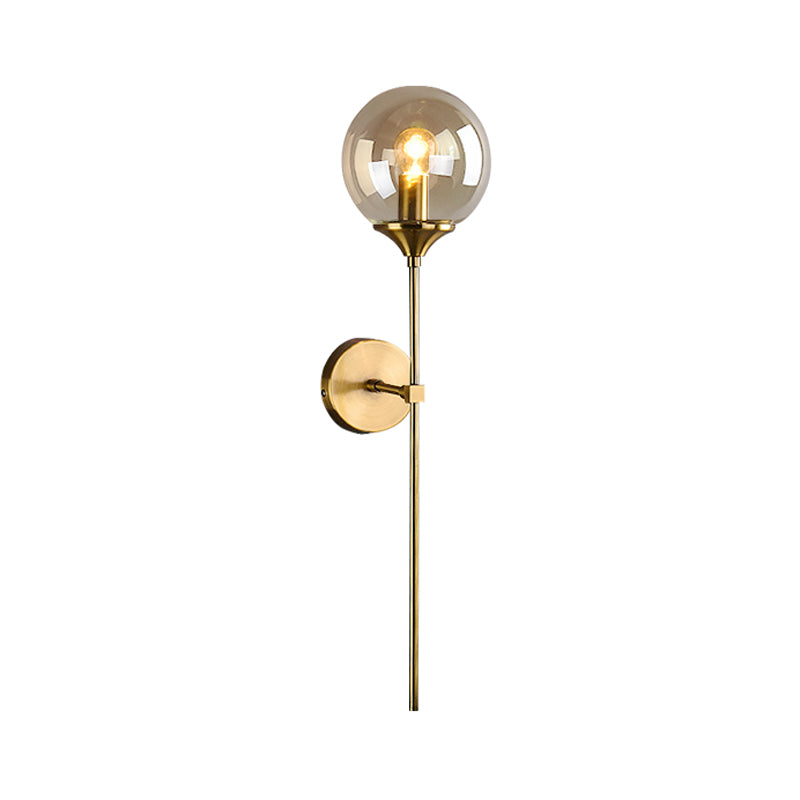Modernist Round Wall Lamp Clear/Amber/Smoke Gray Glass 1 Bulb Bedside Sconce Light Fixture with Metal Pencil Arm - Clearhalo - 'Cast Iron' - 'Glass' - 'Industrial' - 'Modern wall lights' - 'Modern' - 'Tiffany' - 'Traditional wall lights' - 'Wall Lamps & Sconces' - 'Wall Lights' - Lighting' - 325676