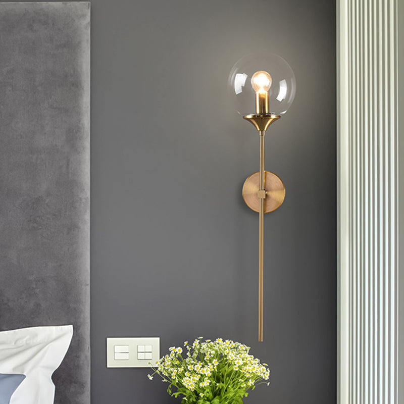 Modernist Round Wall Lamp Clear/Amber/Smoke Gray Glass 1 Bulb Bedside Sconce Light Fixture with Metal Pencil Arm Clear Clearhalo 'Cast Iron' 'Glass' 'Industrial' 'Modern wall lights' 'Modern' 'Tiffany' 'Traditional wall lights' 'Wall Lamps & Sconces' 'Wall Lights' Lighting' 325682