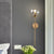 Modernist Round Wall Lamp Clear/Amber/Smoke Gray Glass 1 Bulb Bedside Sconce Light Fixture with Metal Pencil Arm - Clear - Clearhalo - 'Cast Iron' - 'Glass' - 'Industrial' - 'Modern wall lights' - 'Modern' - 'Tiffany' - 'Traditional wall lights' - 'Wall Lamps & Sconces' - 'Wall Lights' - Lighting' - 325682