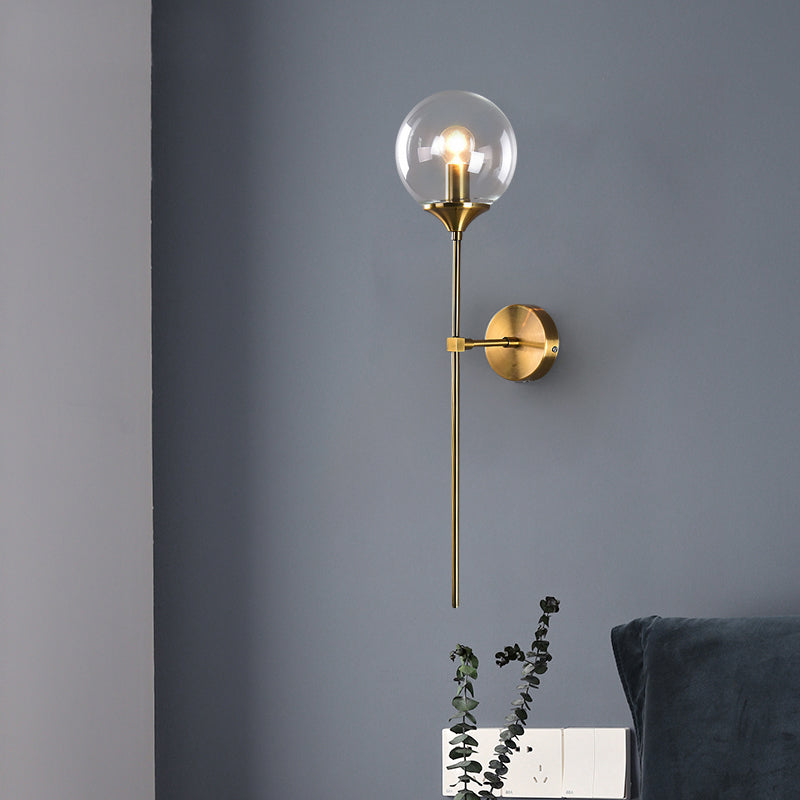 Modernist Round Wall Lamp Clear/Amber/Smoke Gray Glass 1 Bulb Bedside Sconce Light Fixture with Metal Pencil Arm Clearhalo 'Cast Iron' 'Glass' 'Industrial' 'Modern wall lights' 'Modern' 'Tiffany' 'Traditional wall lights' 'Wall Lamps & Sconces' 'Wall Lights' Lighting' 325683