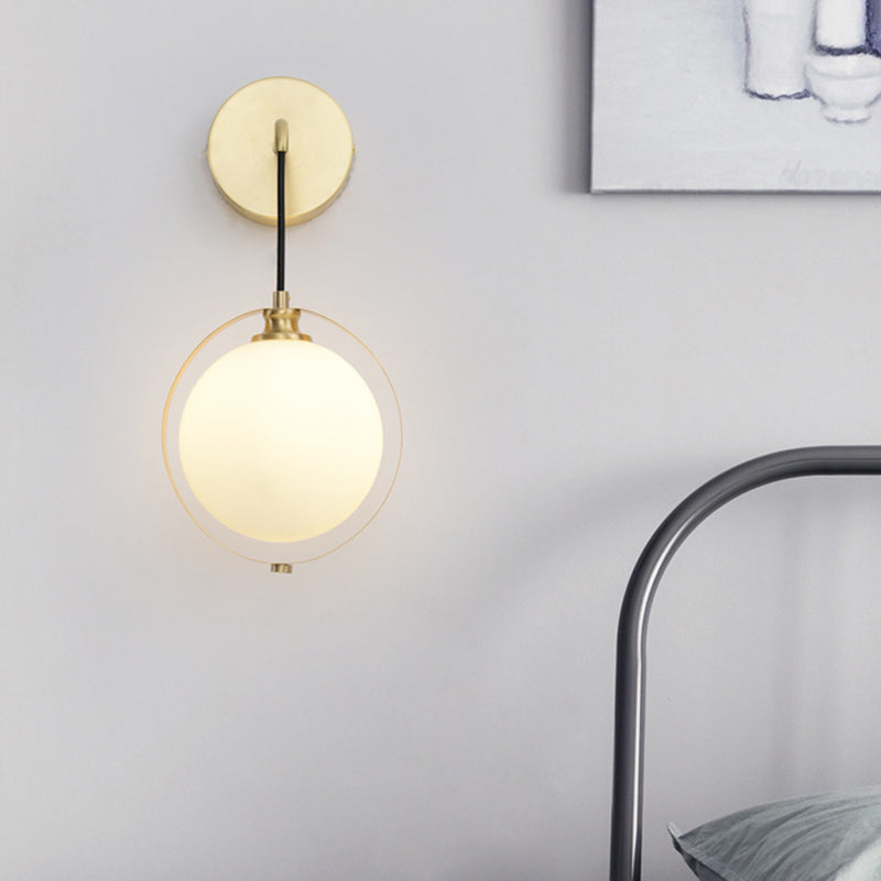 White Glass Ball Sconce Light Modernism 1 Bulb Brass Wall Mount Lamp with Curved Arm Brass Clearhalo 'Cast Iron' 'Glass' 'Industrial' 'Modern wall lights' 'Modern' 'Tiffany' 'Traditional wall lights' 'Wall Lamps & Sconces' 'Wall Lights' Lighting' 325720