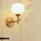Modern Armed Sconce Light Metal 1 Head Wall Mount Lamp in Brass with Ball Opal Glass Shade Clearhalo 'Cast Iron' 'Glass' 'Industrial' 'Modern wall lights' 'Modern' 'Tiffany' 'Traditional wall lights' 'Wall Lamps & Sconces' 'Wall Lights' Lighting' 325891