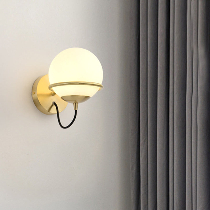 1 Head Bedside Sconce Light Modern Brass Wall Lighting Fixture with Global White Glass Shade Brass Clearhalo 'Cast Iron' 'Glass' 'Industrial' 'Modern wall lights' 'Modern' 'Tiffany' 'Traditional wall lights' 'Wall Lamps & Sconces' 'Wall Lights' Lighting' 325975