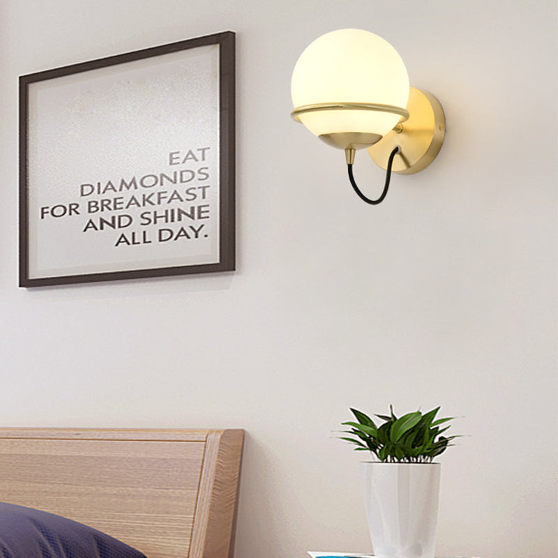 1 Head Bedside Sconce Light Modern Brass Wall Lighting Fixture with Global White Glass Shade Clearhalo 'Cast Iron' 'Glass' 'Industrial' 'Modern wall lights' 'Modern' 'Tiffany' 'Traditional wall lights' 'Wall Lamps & Sconces' 'Wall Lights' Lighting' 325977