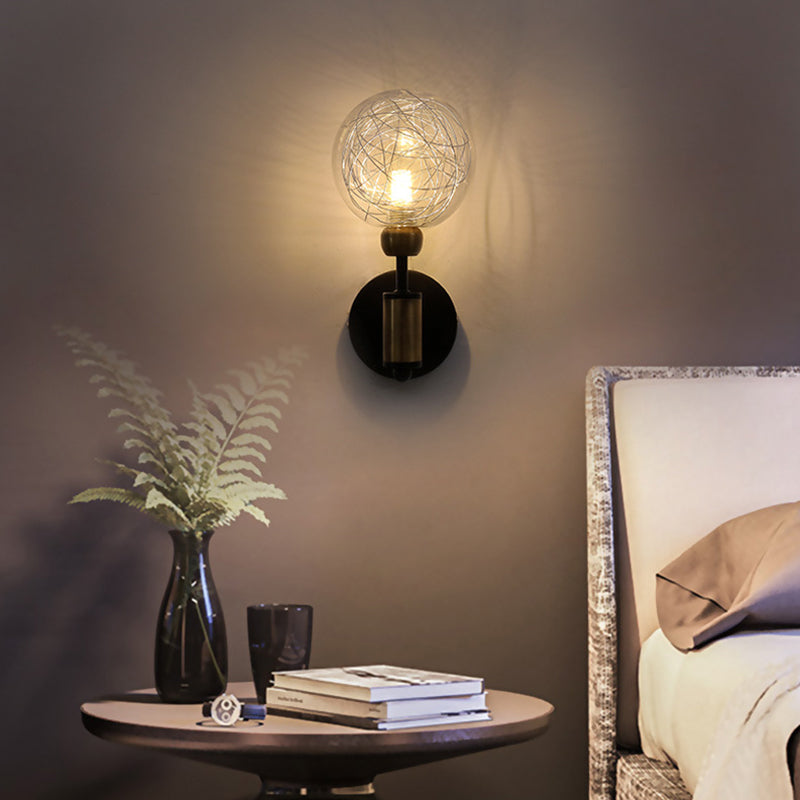 1/2-Light Bedroom Sconce Wall Light Industrial Style Black/Brass Finish Wall Lamp with Orbit Clear Glass Shade Clearhalo 'Art deco wall lights' 'Cast Iron' 'Glass' 'Industrial wall lights' 'Industrial' 'Middle century wall lights' 'Modern' 'Rustic wall lights' 'Tiffany' 'Traditional wall lights' 'Wall Lamps & Sconces' 'Wall Lights' Lighting' 331672