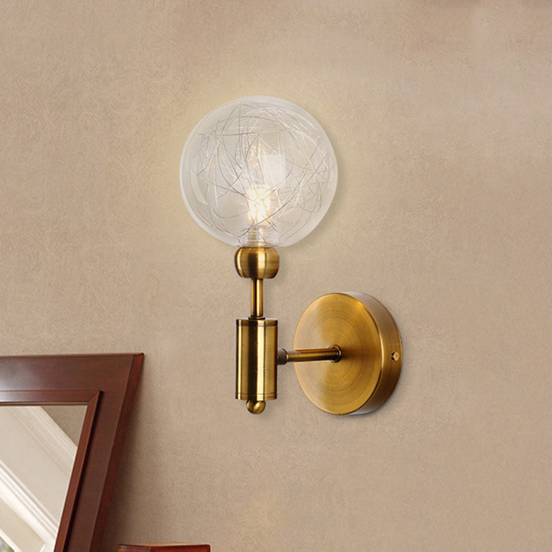 1/2-Light Bedroom Sconce Wall Light Industrial Style Black/Brass Finish Wall Lamp with Orbit Clear Glass Shade 1.0 Brass Clearhalo 'Art deco wall lights' 'Cast Iron' 'Glass' 'Industrial wall lights' 'Industrial' 'Middle century wall lights' 'Modern' 'Rustic wall lights' 'Tiffany' 'Traditional wall lights' 'Wall Lamps & Sconces' 'Wall Lights' Lighting' 331676