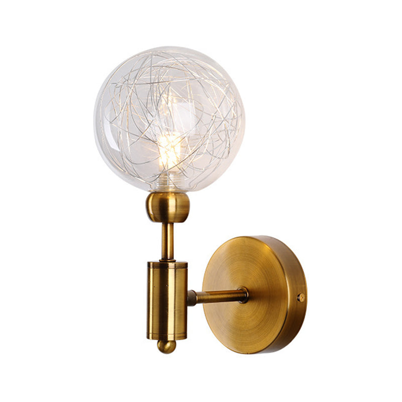1/2-Light Bedroom Sconce Wall Light Industrial Style Black/Brass Finish Wall Lamp with Orbit Clear Glass Shade Clearhalo 'Art deco wall lights' 'Cast Iron' 'Glass' 'Industrial wall lights' 'Industrial' 'Middle century wall lights' 'Modern' 'Rustic wall lights' 'Tiffany' 'Traditional wall lights' 'Wall Lamps & Sconces' 'Wall Lights' Lighting' 331678