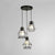 3 Lights Wire Frame Ceiling Light Industrial Style Black Finish Metal Hanging Pendant Light with Round/Linear Canopy Black Round Clearhalo 'Art Deco Pendants' 'Black' 'Cast Iron' 'Ceiling Lights' 'Ceramic' 'Crystal' 'Industrial Pendants' 'Industrial' 'Metal' 'Middle Century Pendants' 'Pendant Lights' 'Pendants' 'Rustic Pendants' 'Tiffany' Lighting' 35109