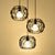 3 Bulbs Pendant Lamp Retro Drum Shade Metal Suspension Light with Wire Frame and Circles Design in Black Black Round Clearhalo 'Art Deco Pendants' 'Black' 'Cast Iron' 'Ceiling Lights' 'Ceramic' 'Crystal' 'Industrial Pendants' 'Industrial' 'Metal' 'Middle Century Pendants' 'Pendant Lights' 'Pendants' 'Rustic Pendants' 'Tiffany' Lighting' 35175