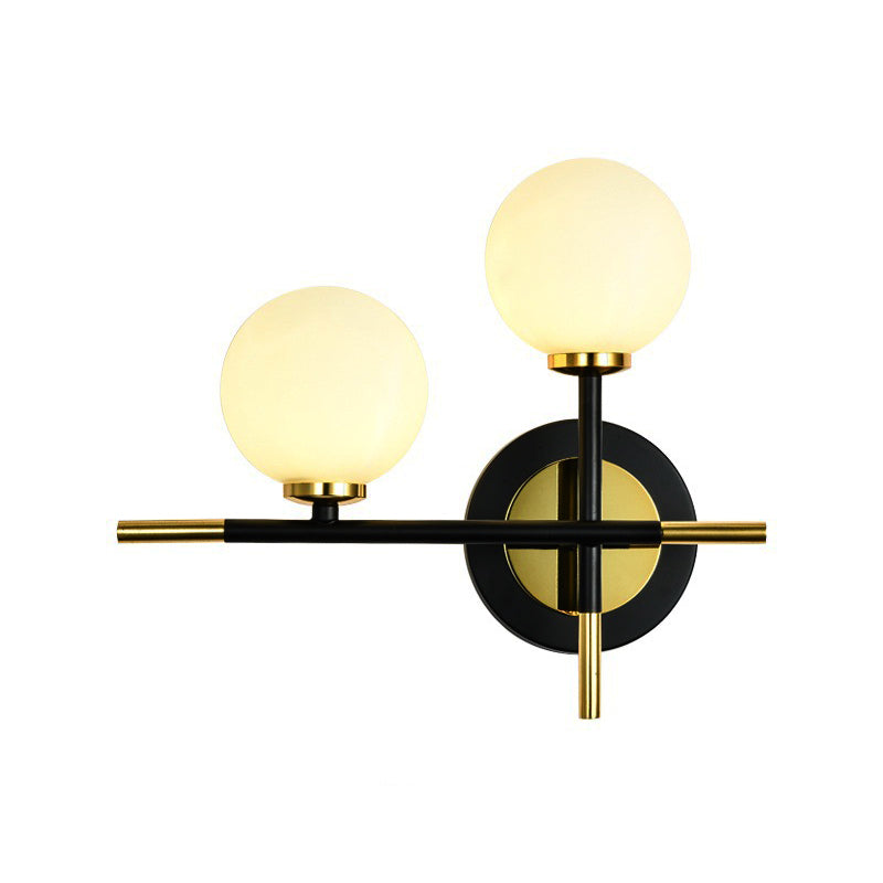 Milk Glass Orb Sconce Light with Cross Design 2 Lights Modern Black and Brass Wall Light Clearhalo 'Cast Iron' 'Glass' 'Industrial' 'Modern wall lights' 'Modern' 'Tiffany' 'Traditional wall lights' 'Vanity Lights' 'Wall Lights' Lighting' 370192