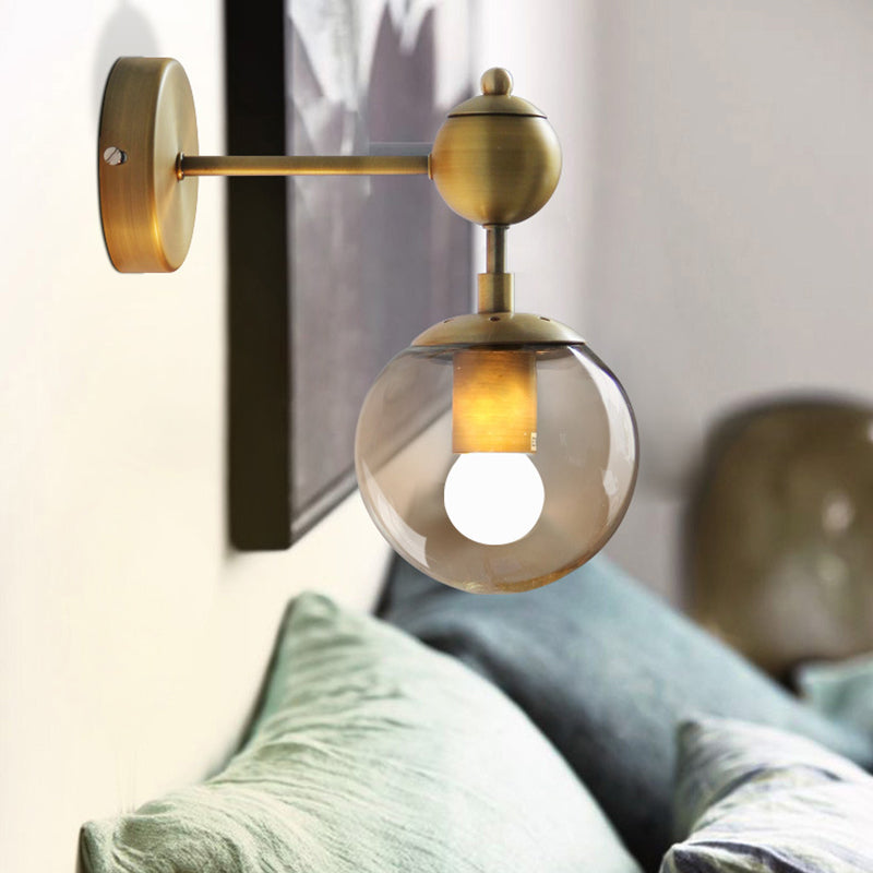 1/2-Head Global Wall Mount Light with Amber Glass Shade Modernist Wall Sconce Lighting in Gold for Bedroom Clearhalo 'Cast Iron' 'Glass' 'Industrial' 'Modern wall lights' 'Modern' 'Tiffany' 'Traditional wall lights' 'Vanity Lights' 'Wall Lights' Lighting' 370202