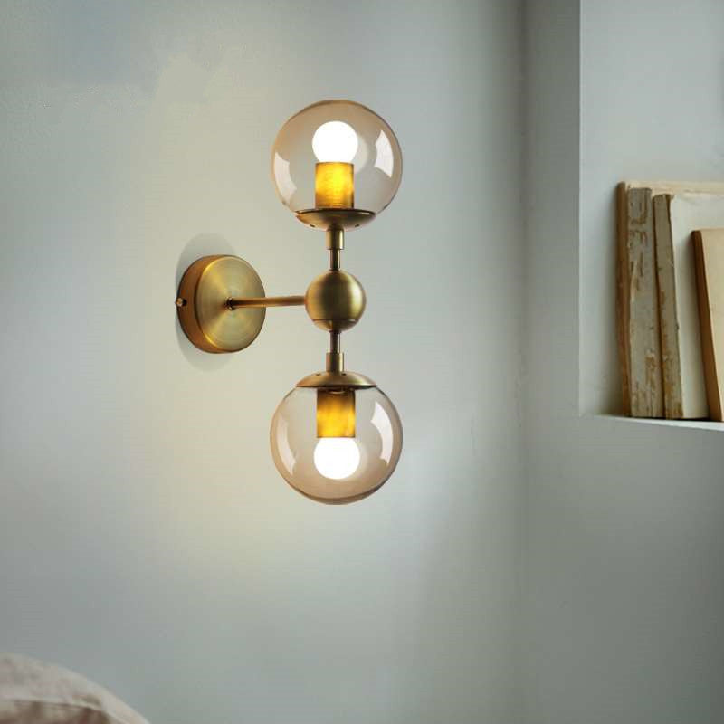 1/2-Head Global Wall Mount Light with Amber Glass Shade Modernist Wall Sconce Lighting in Gold for Bedroom 2.0 Gold Clearhalo 'Cast Iron' 'Glass' 'Industrial' 'Modern wall lights' 'Modern' 'Tiffany' 'Traditional wall lights' 'Vanity Lights' 'Wall Lights' Lighting' 370205