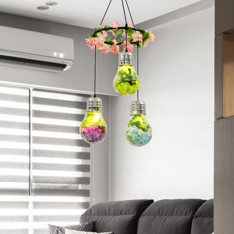 Clear Glass Bulb Cluster Pendant Industrial 3 Lights Restaurant LED Ceiling Lamp in Black with Flower Decoration Clearhalo 'Ceiling Lights' 'Glass shade' 'Glass' 'Industrial Pendants' 'Industrial' 'Middle Century Pendants' 'Pendant Lights' 'Pendants' 'Tiffany' Lighting' 400996