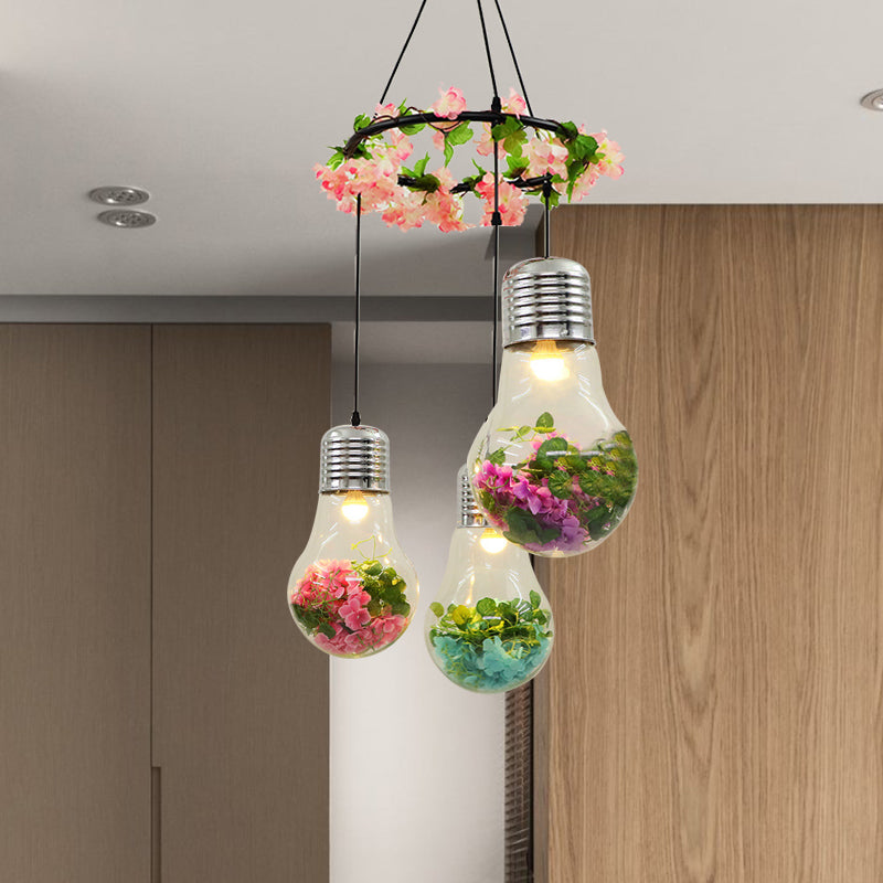 Clear Glass Bulb Cluster Pendant Industrial 3 Lights Restaurant LED Ceiling Lamp in Black with Flower Decoration Black B Clearhalo 'Ceiling Lights' 'Glass shade' 'Glass' 'Industrial Pendants' 'Industrial' 'Middle Century Pendants' 'Pendant Lights' 'Pendants' 'Tiffany' Lighting' 400999