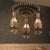 Bottle Caged Iron Ceiling Hanging Light Rustic Industrial 3 Lights Bar Pendant Lamp with Gear Decoration Bronze Clearhalo 'Ceiling Lights' 'Industrial Pendants' 'Industrial' 'Middle Century Pendants' 'Pendant Lights' 'Pendants' 'Tiffany' Lighting' 456339