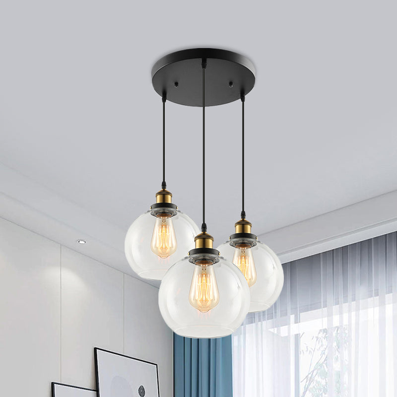 3/4-Light Clear Glass Multi Hanging Light Fixture Industrial Antique Brass Orb Living Room Pendant with Round Canopy Clearhalo 'Ceiling Lights' 'Glass shade' 'Glass' 'Industrial Pendants' 'Industrial' 'Middle Century Pendants' 'Pendant Lights' 'Pendants' 'Tiffany' Lighting' 460282