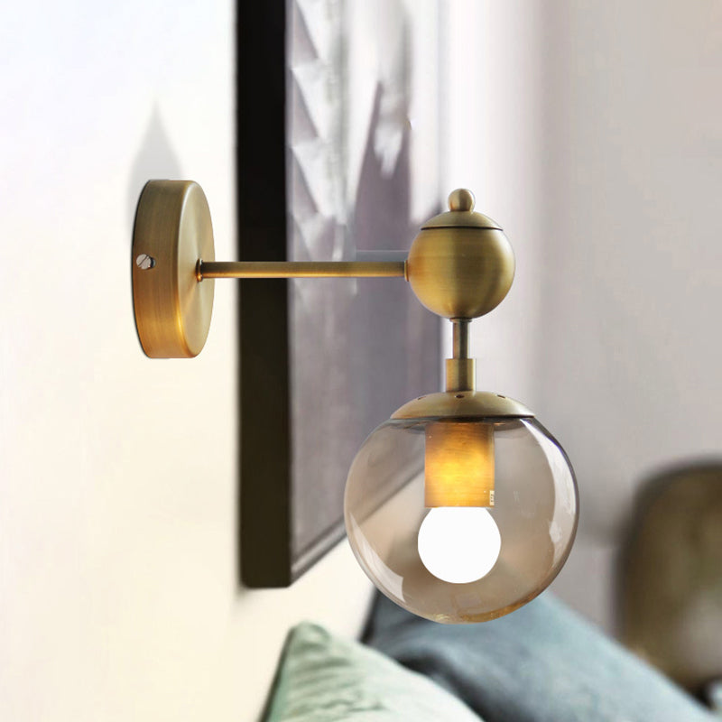 1/2-Head Global Wall Mount Light with Amber Glass Shade Modernist Wall Sconce Lighting in Gold for Bedroom Clearhalo 'Cast Iron' 'Glass' 'Industrial' 'Modern wall lights' 'Modern' 'Tiffany' 'Traditional wall lights' 'Vanity Lights' 'Wall Lights' Lighting' 466101