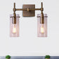 Clear Glass Cylinder Wall Sconce Modern 2 Lights Dining Room Lighting Fixture in Aged Brass Clearhalo 'Cast Iron' 'Glass' 'Industrial wall lights' 'Industrial' 'Middle century wall lights' 'Modern' 'Tiffany' 'Traditional wall lights' 'Wall Lamps & Sconces' 'Wall Lights' Lighting' 467674