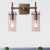 Clear Glass Cylinder Wall Sconce Modern 2 Lights Dining Room Lighting Fixture in Aged Brass Clearhalo 'Cast Iron' 'Glass' 'Industrial wall lights' 'Industrial' 'Middle century wall lights' 'Modern' 'Tiffany' 'Traditional wall lights' 'Wall Lamps & Sconces' 'Wall Lights' Lighting' 467674