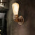 Bare Bulb Living Room Wall Sconce Lighting with Pipe Rustic Stylish Metal 1 Head Black/Bronze Wall Mount Light Brass Clearhalo 'Art deco wall lights' 'Cast Iron' 'Glass' 'Industrial wall lights' 'Industrial' 'Middle century wall lights' 'Modern' 'Rustic wall lights' 'Tiffany' 'Traditional wall lights' 'Wall Lamps & Sconces' 'Wall Lights' Lighting' 493867