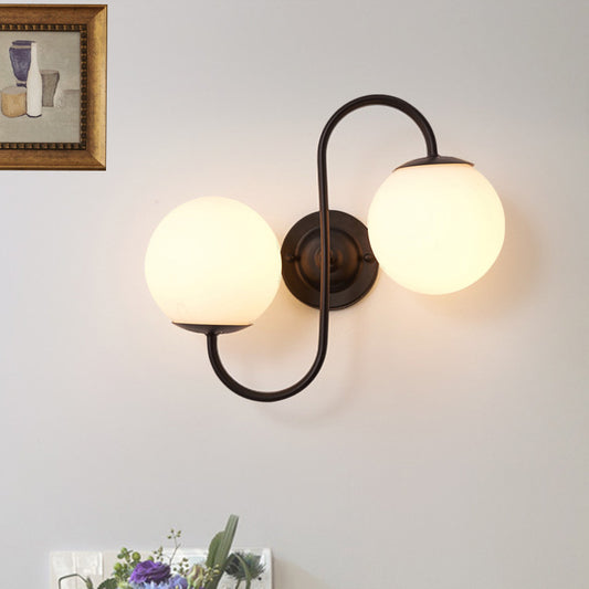 2-Light Round Sconce Light Fixture Modern Black White Glass Wall Lamp for Living Room Clearhalo 'Cast Iron' 'Glass' 'Industrial' 'Modern wall lights' 'Modern' 'Tiffany' 'Traditional wall lights' 'Wall Lamps & Sconces' 'Wall Lights' Lighting' 493893