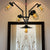 Abstract Pipe Living Room Pendant Vintage Metallic 5-Light Black Hanging Chandelier with Wire Cage Black Clearhalo 'Cast Iron' 'Ceiling Lights' 'Chandeliers' 'Industrial Chandeliers' 'Industrial' 'Metal' 'Middle Century Chandeliers' 'Rustic Chandeliers' 'Tiffany' Lighting' 519098