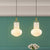 Gold Schoolhouse Pendant Light Fixture Modernist 1 Bulb White Glass Ceiling Lamp with Cage White Clearhalo 'Ceiling Lights' 'Glass shade' 'Glass' 'Modern Pendants' 'Modern' 'Pendant Lights' 'Pendants' Lighting' 519946