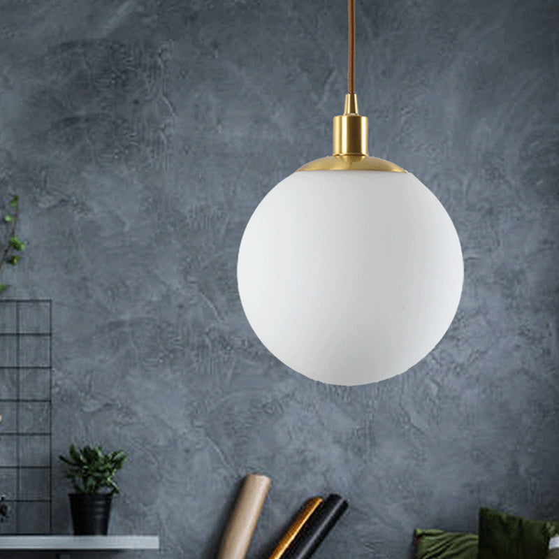 Frosted White Glass Ball Pendant Lighting Simple 1-Light 6"/8"/10" Wide Brass Suspension Ceiling Lamp White Clearhalo 'Ceiling Lights' 'Glass shade' 'Glass' 'Modern Pendants' 'Modern' 'Pendant Lights' 'Pendants' Lighting' 519956