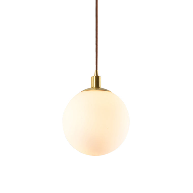 Frosted White Glass Ball Pendant Lighting Simple 1-Light 6"/8"/10" Wide Brass Suspension Ceiling Lamp Clearhalo 'Ceiling Lights' 'Glass shade' 'Glass' 'Modern Pendants' 'Modern' 'Pendant Lights' 'Pendants' Lighting' 519958