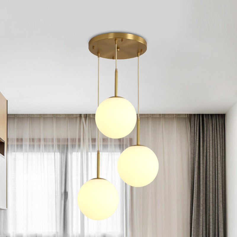 Orb Hanging Ceiling Light Modernism White Glass 3 Lights Brass Multi Lamp Pendant with Round Canopy Clearhalo 'Ceiling Lights' 'Glass shade' 'Glass' 'Modern Pendants' 'Modern' 'Pendant Lights' 'Pendants' Lighting' 520087