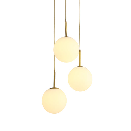 Orb Hanging Ceiling Light Modernism White Glass 3 Lights Brass Multi Lamp Pendant with Round Canopy Clearhalo 'Ceiling Lights' 'Glass shade' 'Glass' 'Modern Pendants' 'Modern' 'Pendant Lights' 'Pendants' Lighting' 520088