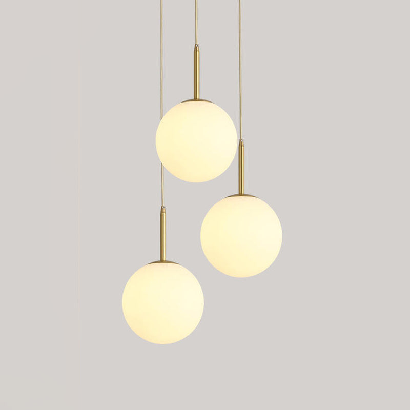 Orb Hanging Ceiling Light Modernism White Glass 3 Lights Brass Multi Lamp Pendant with Round Canopy Clearhalo 'Ceiling Lights' 'Glass shade' 'Glass' 'Modern Pendants' 'Modern' 'Pendant Lights' 'Pendants' Lighting' 520089