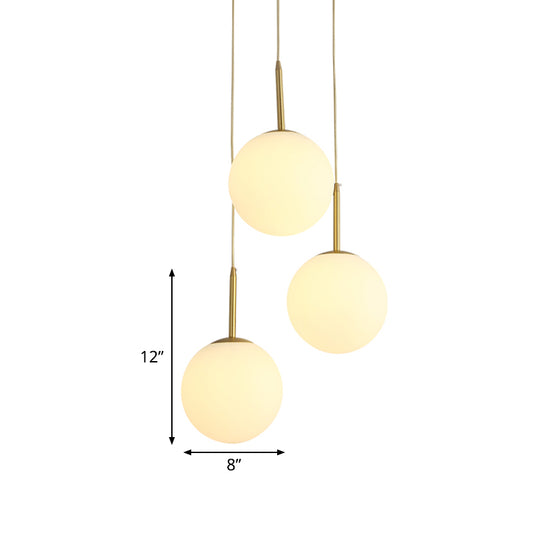 Orb Hanging Ceiling Light Modernism White Glass 3 Lights Brass Multi Lamp Pendant with Round Canopy Clearhalo 'Ceiling Lights' 'Glass shade' 'Glass' 'Modern Pendants' 'Modern' 'Pendant Lights' 'Pendants' Lighting' 520090