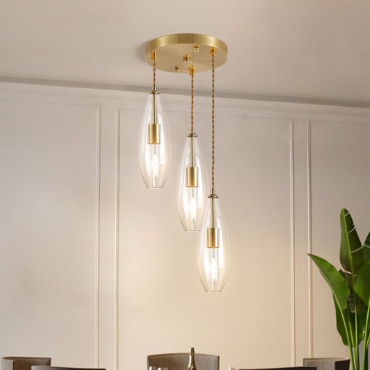 Brass Waterdrop Multi Light Pendant Modernist 3 Bulbs Clear Glass Suspension Lamp with Round Canopy Brass Clearhalo 'Ceiling Lights' 'Chandeliers' 'Glass shade' 'Glass' 'Modern Pendants' 'Modern' 'Pendant Lights' 'Pendants' Lighting' 520101