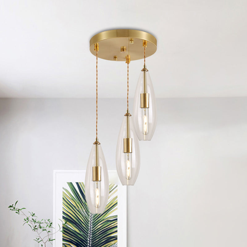 Brass Waterdrop Multi Light Pendant Modernist 3 Bulbs Clear Glass Suspension Lamp with Round Canopy Clearhalo 'Ceiling Lights' 'Chandeliers' 'Glass shade' 'Glass' 'Modern Pendants' 'Modern' 'Pendant Lights' 'Pendants' Lighting' 520102