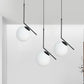 Cream Glass Orb Clster Pendant Light Modernism 3-Light Ceiling Lamp in Black with Angled Arm Clearhalo 'Ceiling Lights' 'Glass shade' 'Glass' 'Modern Pendants' 'Modern' 'Pendant Lights' 'Pendants' Lighting' 520133
