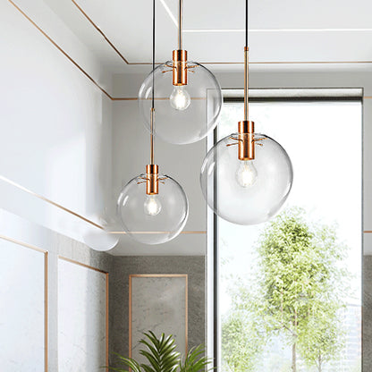 Rose Gold Round Cluster Pendant Light Minimalist 3-Bulb Clear Glass Ceiling Hang Fixture Rose Gold Clearhalo 'Ceiling Lights' 'Glass shade' 'Glass' 'Modern Pendants' 'Modern' 'Pendant Lights' 'Pendants' Lighting' 520176