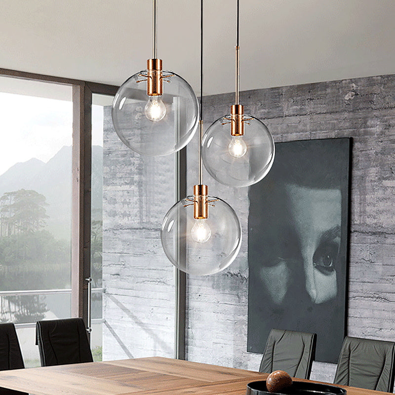 Rose Gold Round Cluster Pendant Light Minimalist 3-Bulb Clear Glass Ceiling Hang Fixture Clearhalo 'Ceiling Lights' 'Glass shade' 'Glass' 'Modern Pendants' 'Modern' 'Pendant Lights' 'Pendants' Lighting' 520177