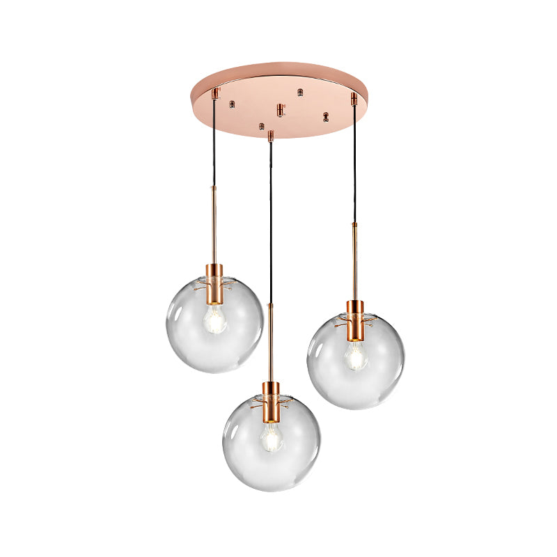Rose Gold Round Cluster Pendant Light Minimalist 3-Bulb Clear Glass Ceiling Hang Fixture Clearhalo 'Ceiling Lights' 'Glass shade' 'Glass' 'Modern Pendants' 'Modern' 'Pendant Lights' 'Pendants' Lighting' 520178